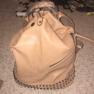 Tan/ Caramel colored leather backpack